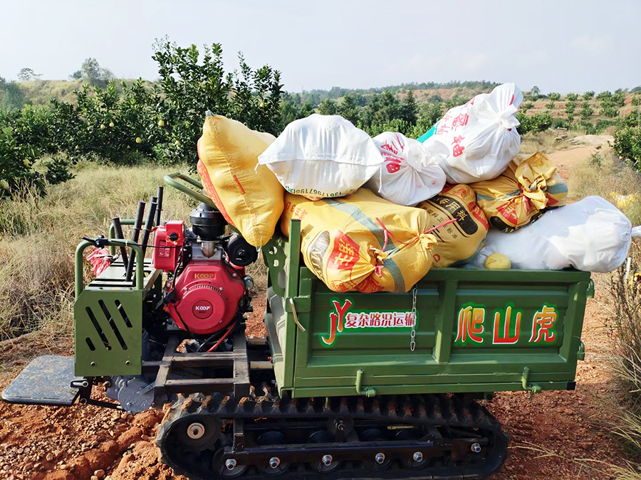 800-5Side view of yellow crawler transporter with diesel engine, durable tracked dumper for small farms and orchards